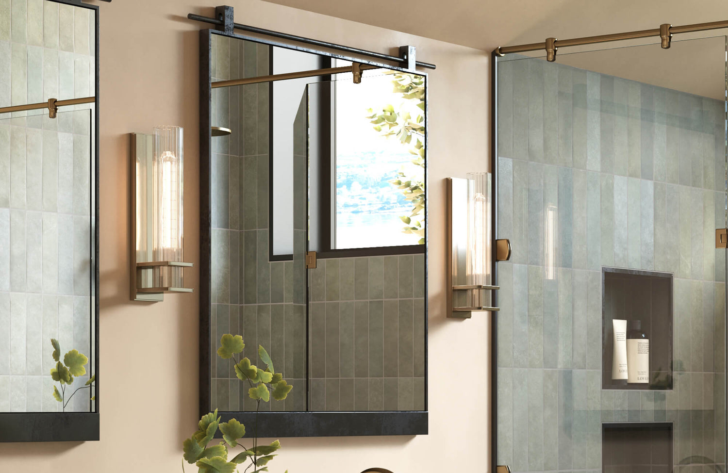 Modern bathroom featuring sleek glass tube wall sconces, brass-framed mirror with sliding rail, and vertically stacked sage green tile walls