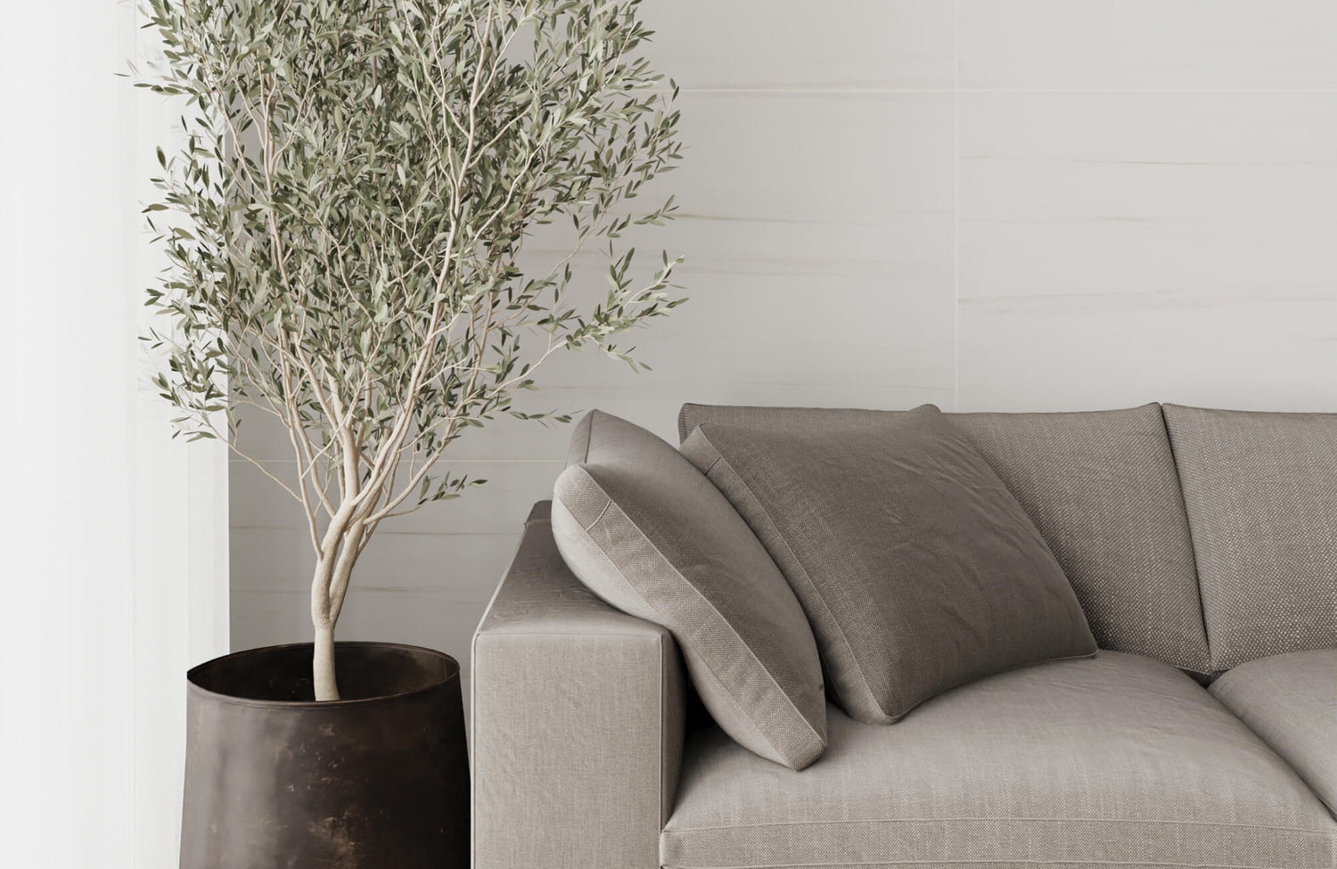 Outdoor sofa with plush cushions and supportive pillows, reflecting the comfort and support considerations when comparing feather pillows vs synthetic pillows.