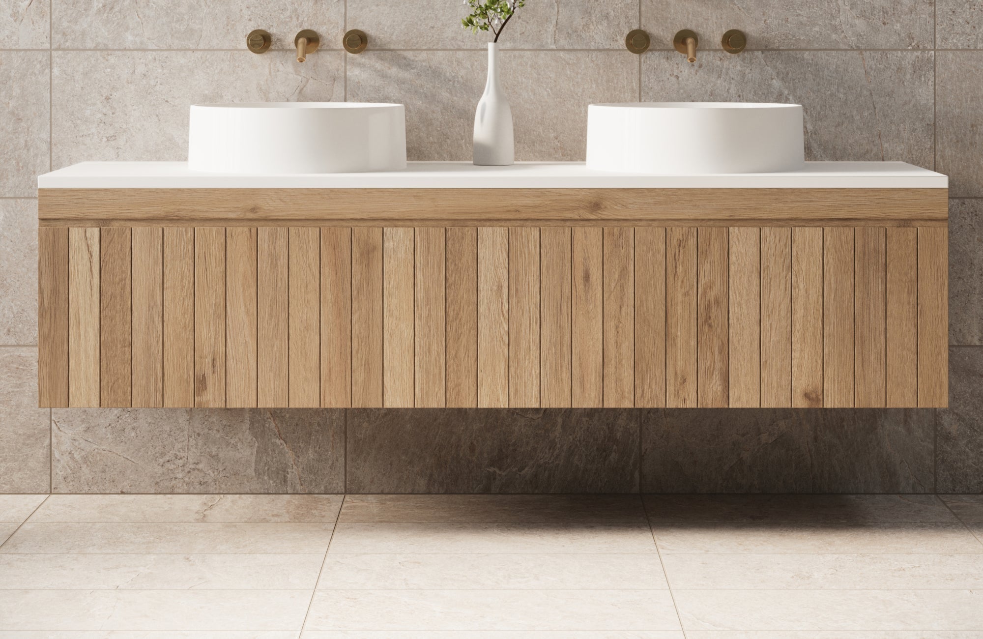 Natural oak floating vanity with vertical slat panels and dual vessel sinks, set against warm stone tile walls.