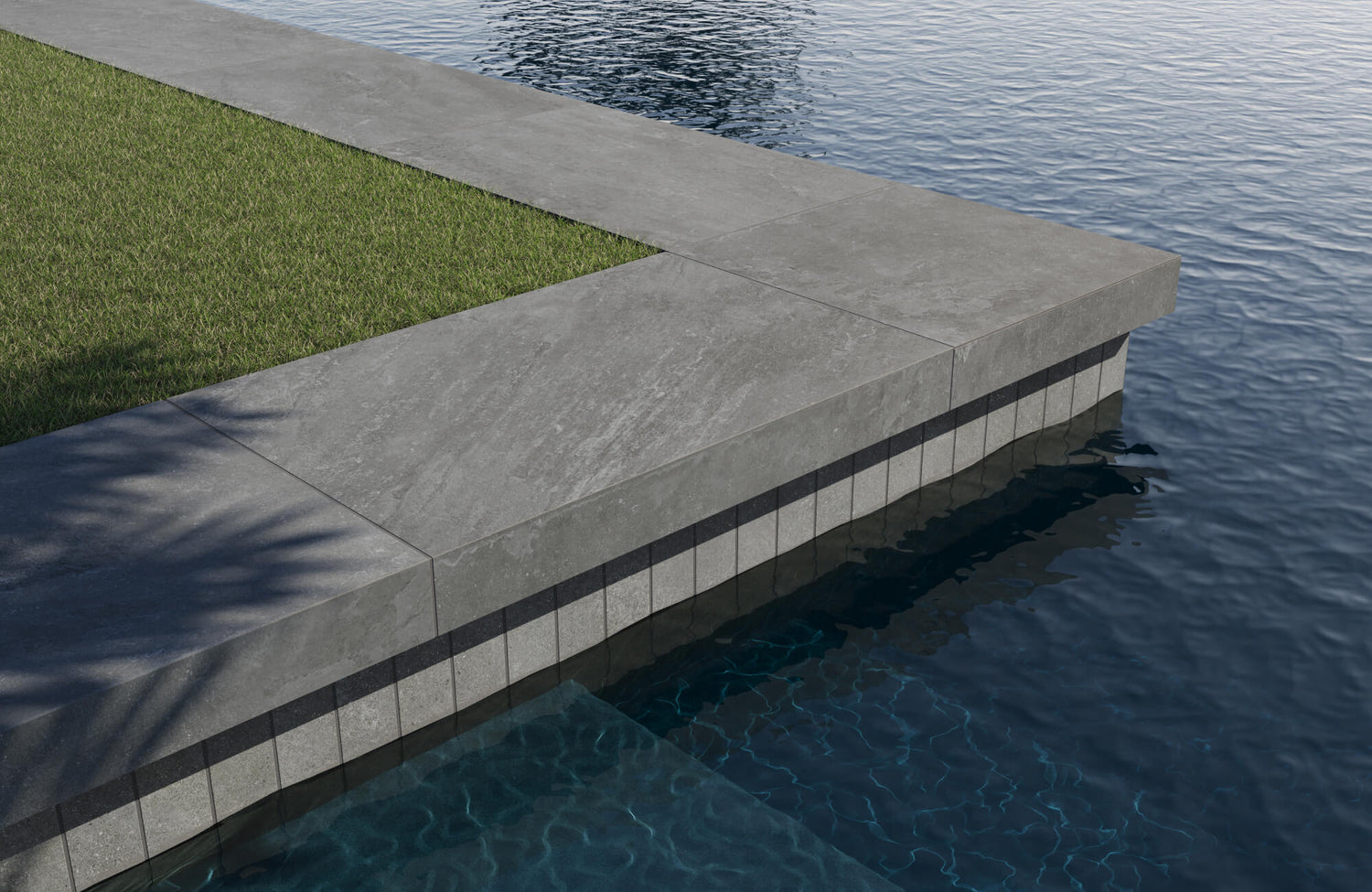 Modern outdoor design with sleek gray pavers bordering a crystal-clear pool for a clean and sophisticated look.