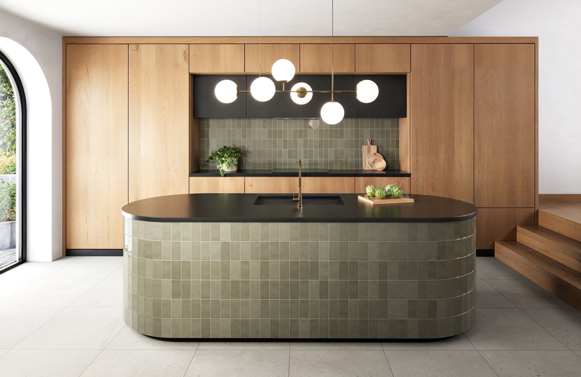 Sleek modern kitchen featuring an olive green subway tiled island with a curved design, complementing the matching backsplash and warm wood cabinetry.