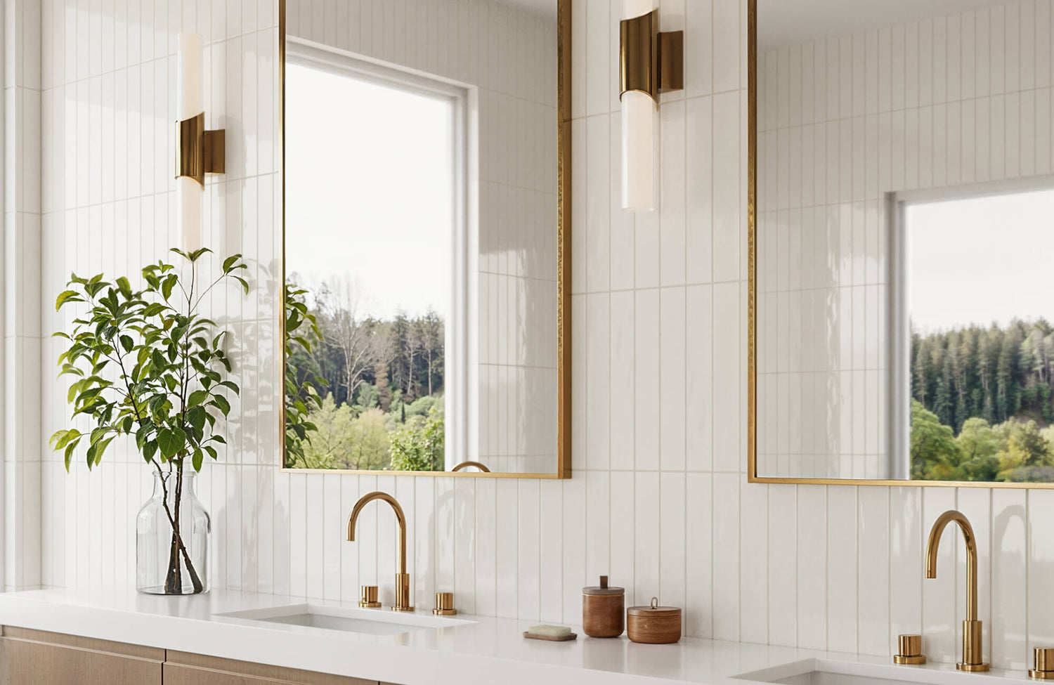 Elegant bathroom with white vertical subway tiles, gold accents, and a large mirror reflecting lush greenery outside.