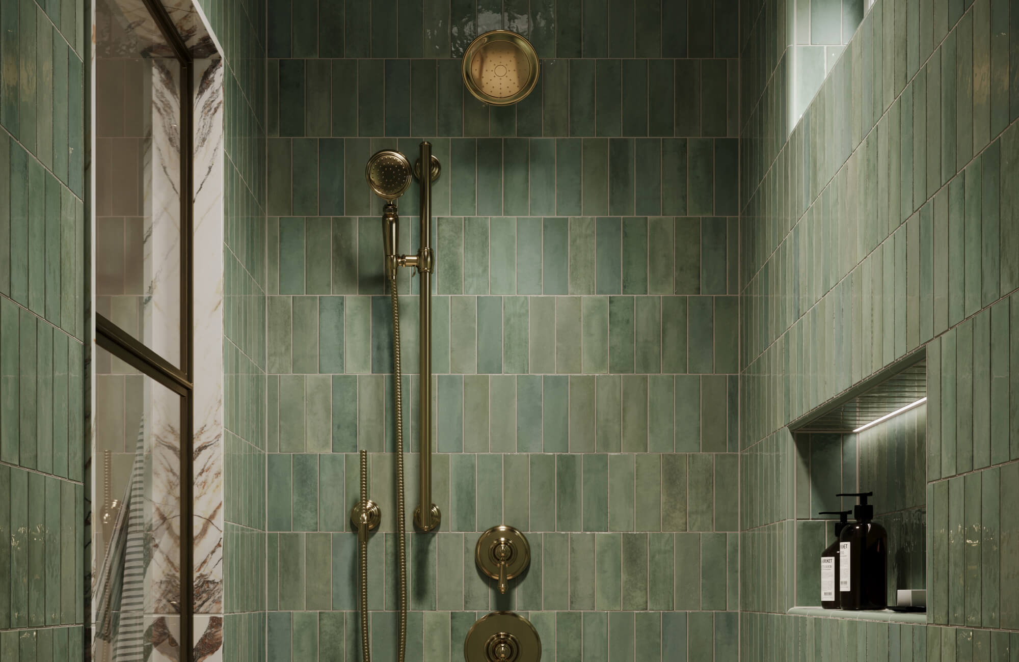 Glossy sage green subway tiles line a shower in mixed vertical and horizontal layouts with brass shower fixtures, a recessed niche, and marble trim.