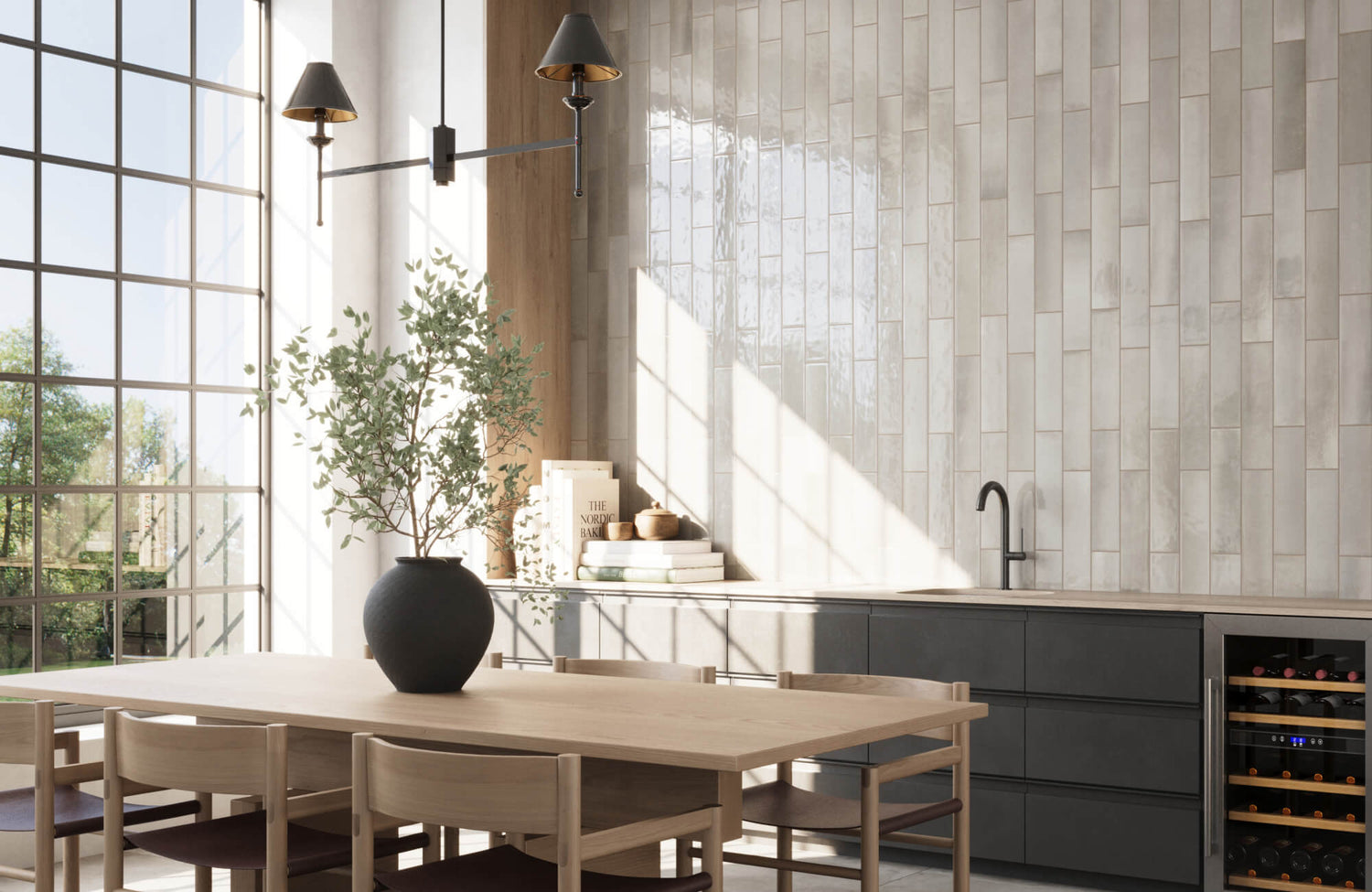 Vertical subway tiles in a neutral finish add texture and elegance to a modern dining and kitchen space.