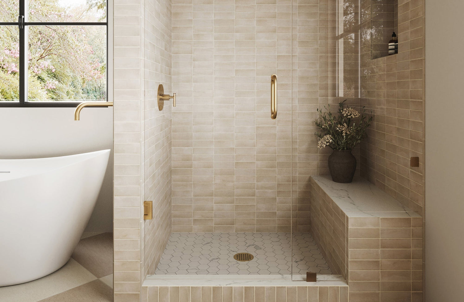 Walk-in shower with hexagon mosaic tile floor in a soft beige tone, offering grip and contrast to stacked wall tiles.