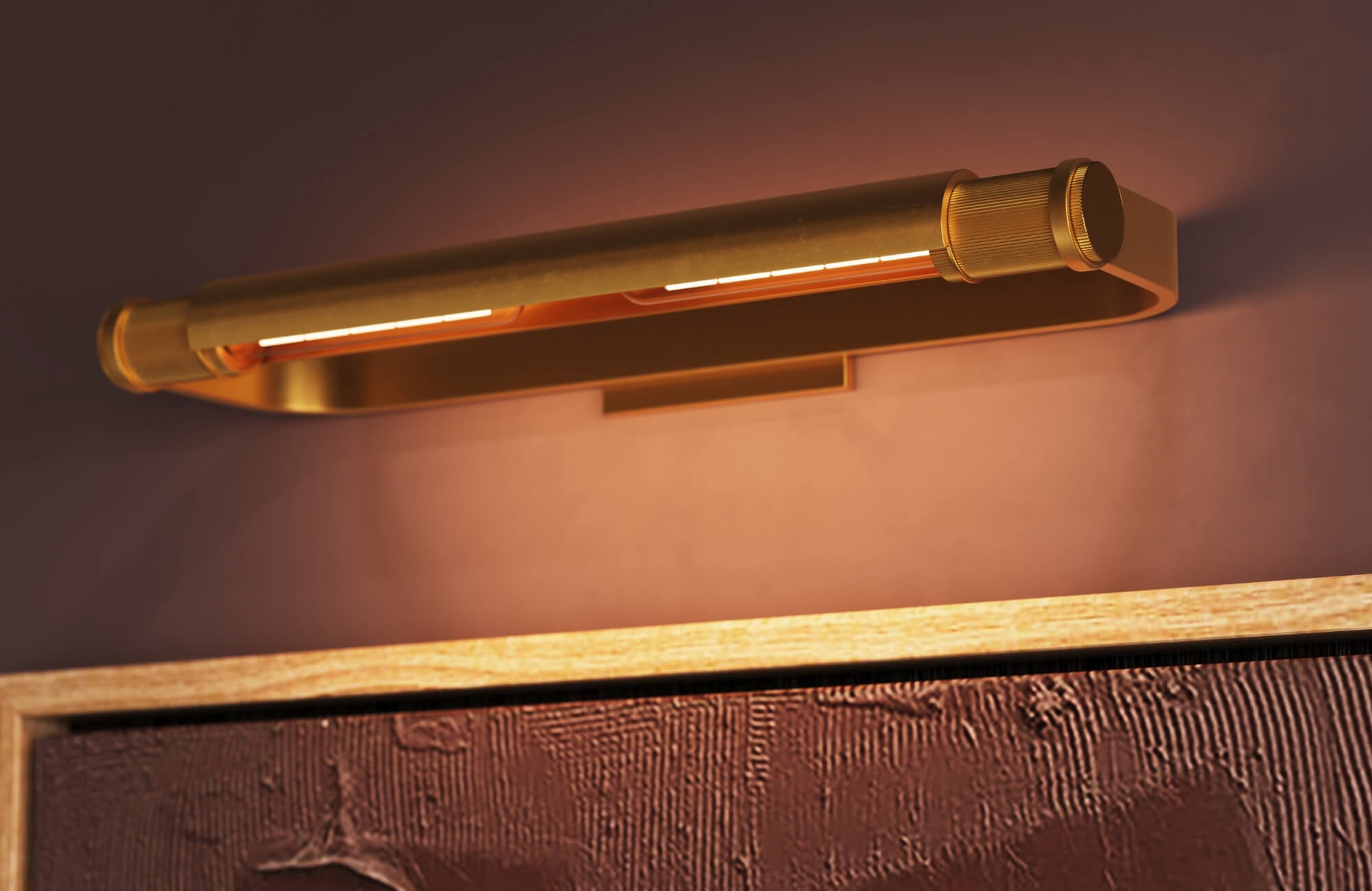 Dimmable brass picture light casting a warm ambient glow over framed artwork, highlighting how art lighting can enhance mood and atmosphere.