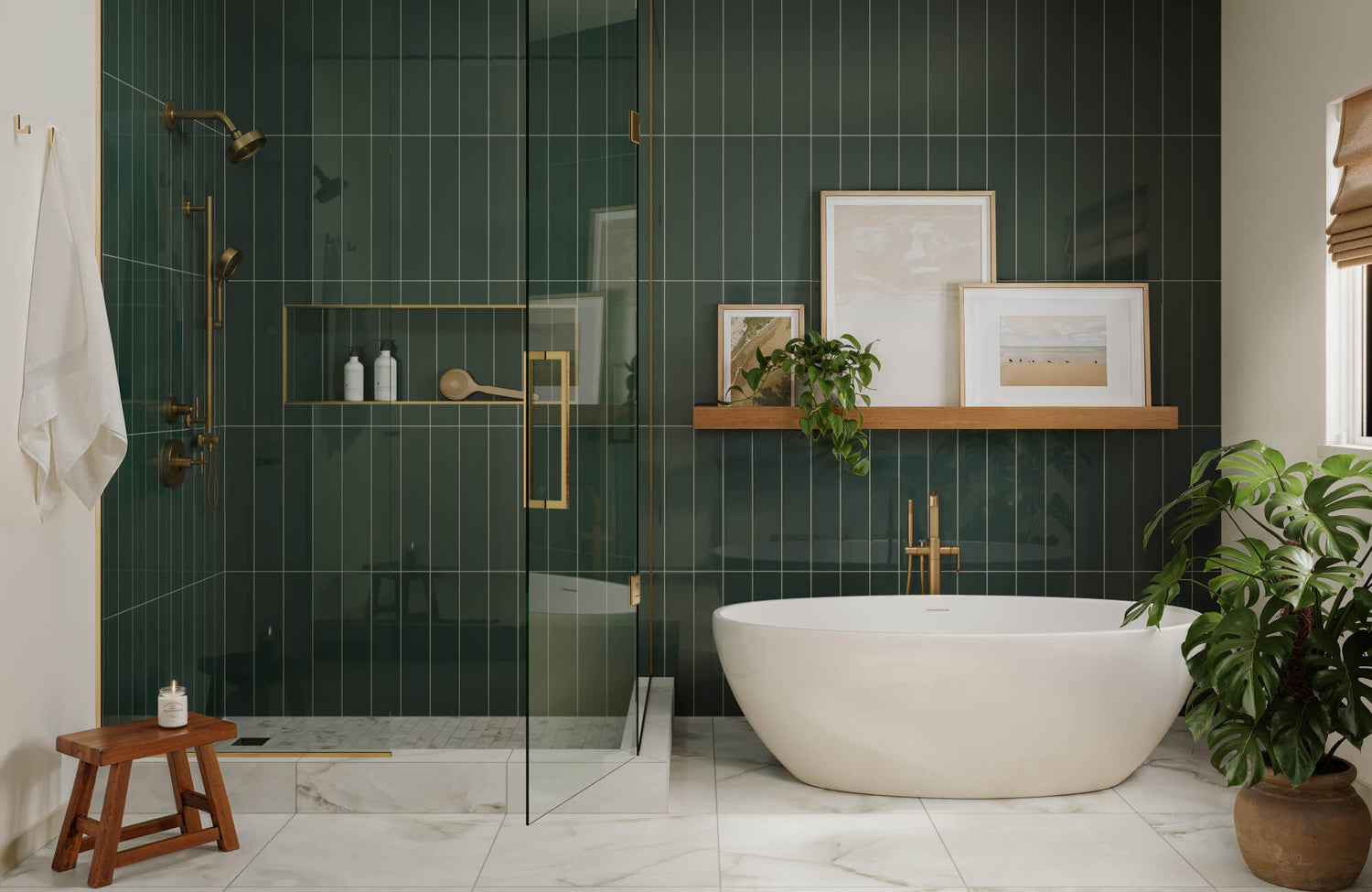 Moody bathroom with dark green glossy subway tiles, gold fixtures, and framed art for a warm, luxurious atmosphere.