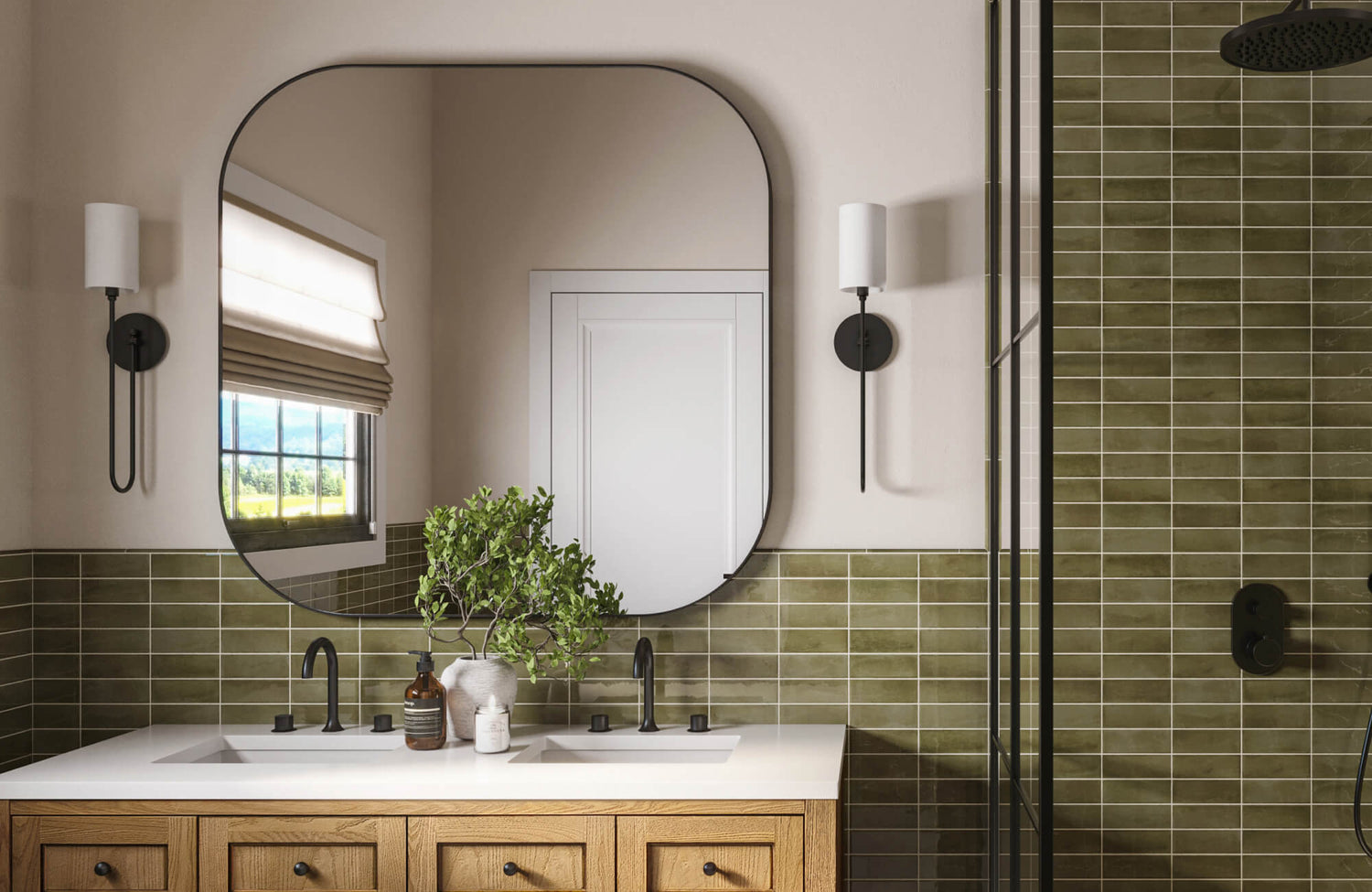 Glossy olive green subway tiles with soft-rounded mirror, black fixtures, and warm wood cabinetry.