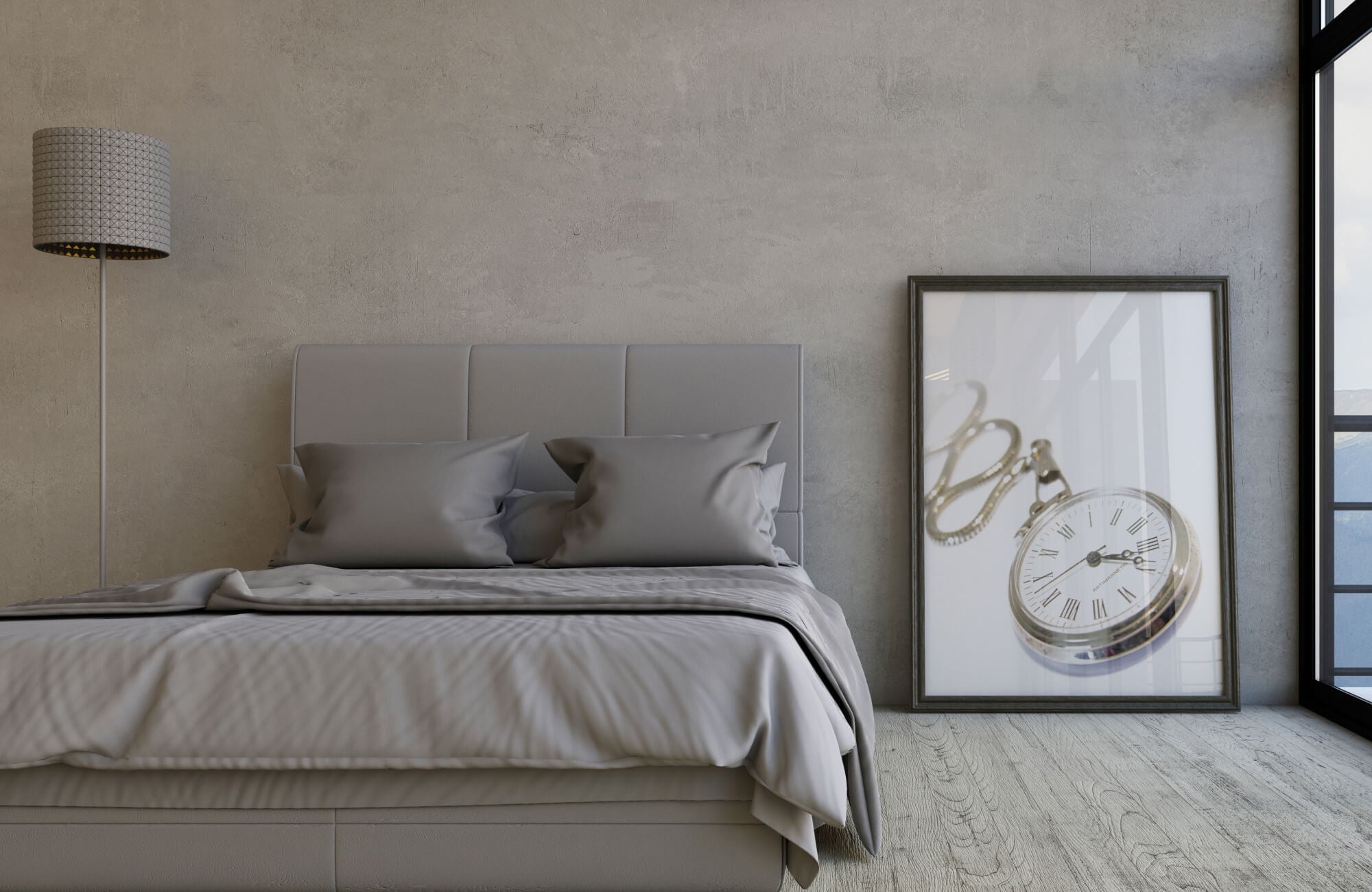 Wall art featuring a framed vintage pocket watch print leaning against a textured wall beside a modern upholstered bed, adding a sophisticated focal point to the neutral bedroom interior.