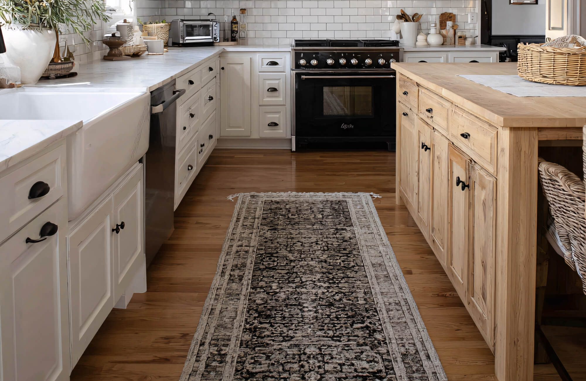 Bright kitchen with white cabinetry and island set over warm wood look tile flooring, showcasing durability and classic hardwood style.