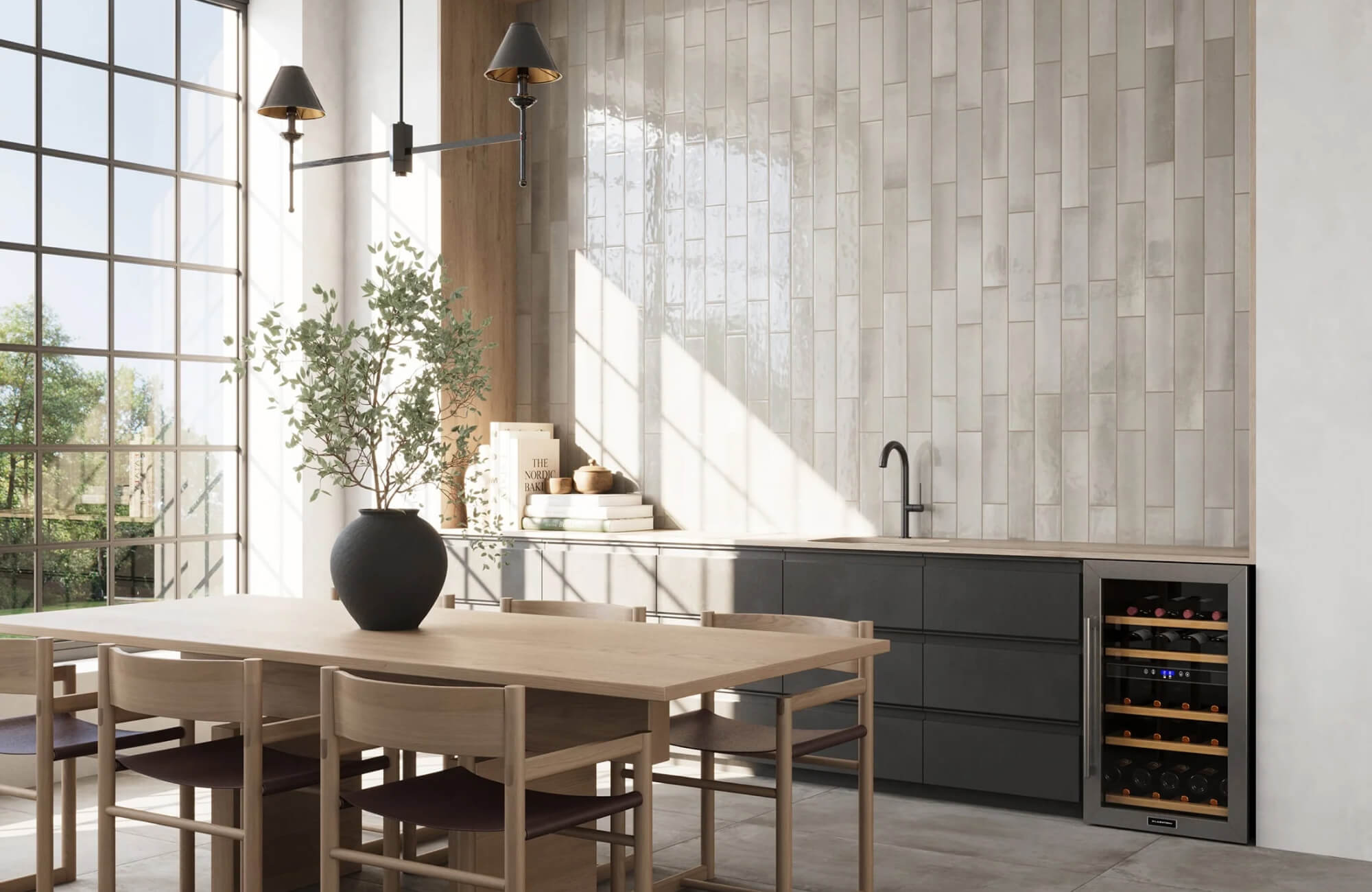 Modern kitchen featuring a sleek black faucet, wine cooler, and vertical beige subway tile backsplash, with natural light streaming in through large windows.