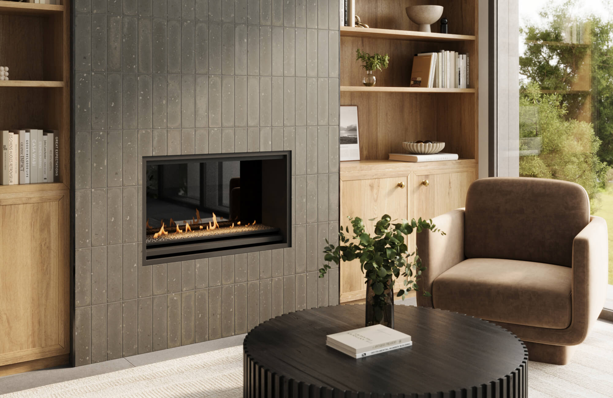 Modern living room with a sleek fireplace surrounded by dark, vertically-oriented subway tiles, wooden bookshelves, and a cozy armchair.