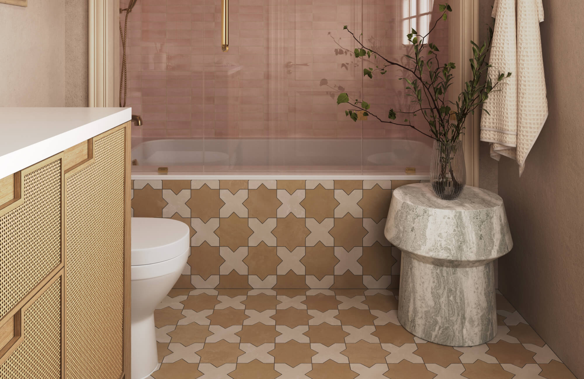 Small bathroom designed with warm patterned floor and tub surround tiles, soft blush shower wall tiles behind clear glass, a woven-front vanity, and natural stone accents that create a cozy yet refined spa-inspired atmosphere.