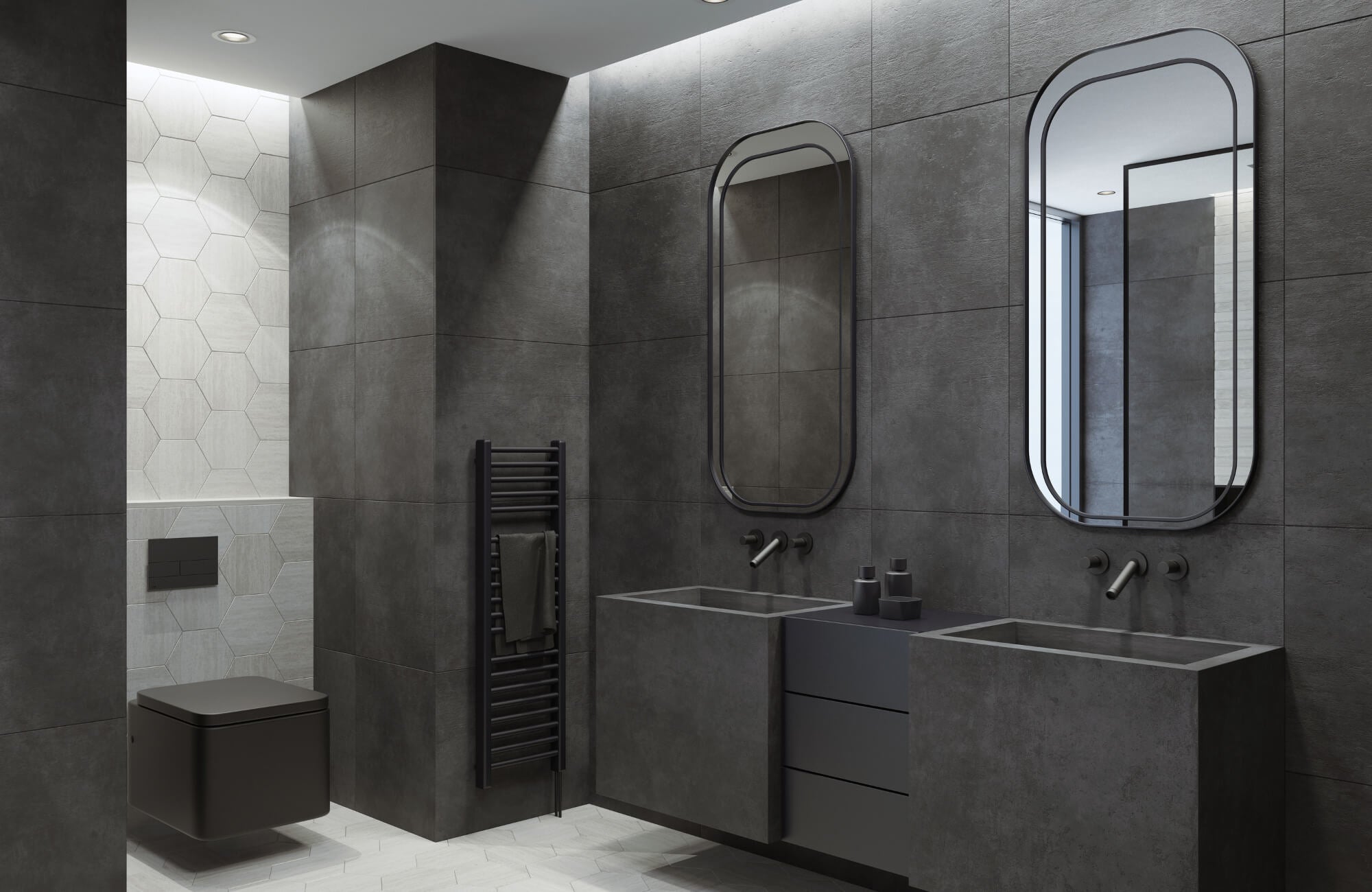Modern bathroom featuring matte black tiles, floating vanities, dual mirrors, and light gray hexagonal accent tiles near the toilet area.