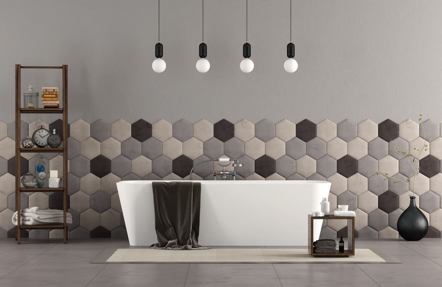 Modern bathroom with a white freestanding tub, hexagon tile accent wall in neutral tones, pendant lighting, and minimalist decor.