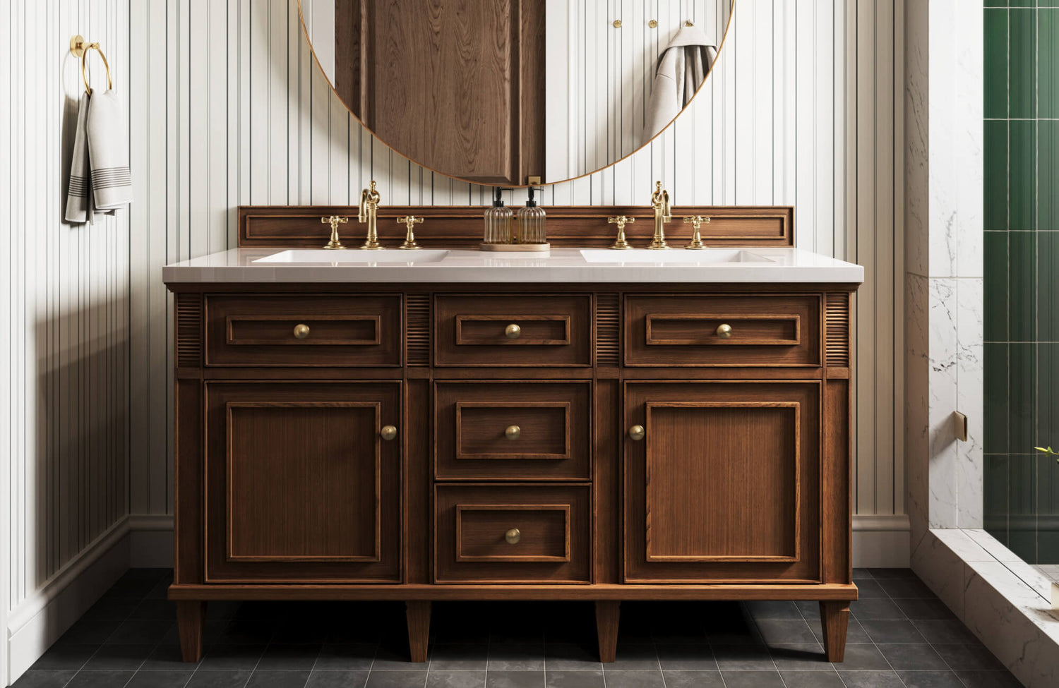Classic bathroom vanity with rich wood cabinetry, brass hardware and faucets, set against striped wall paneling and a round mirror.