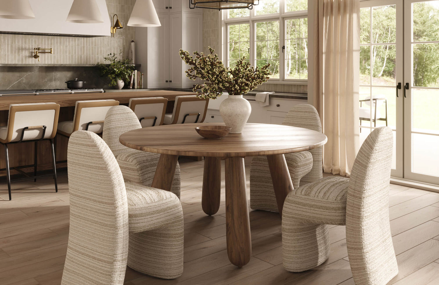 A round wooden dining table with upholstered chairs, showing how a circular table shape supports easy movement and comfortable spacing in an open dining area.