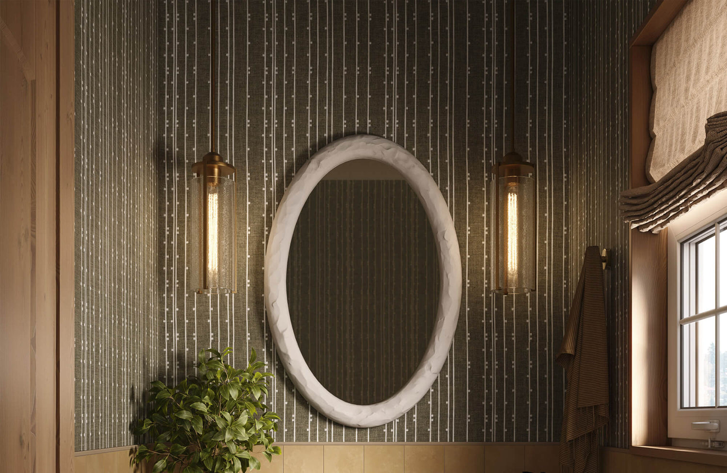 Dark textured vertical stripe wallpaper with oval marble mirror, brass sconces, and greenery for a warm modern bathroom.