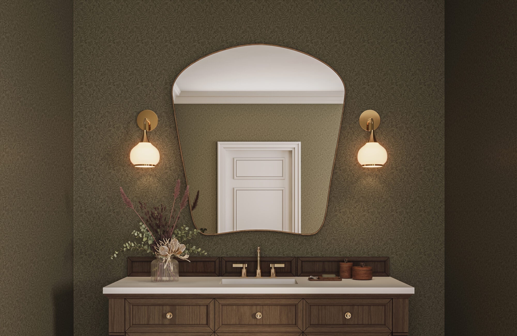 Statement bathroom design featuring textured green wallpaper, asymmetrical wall mirror, warm wood cabinetry, and soft globe wall lights.