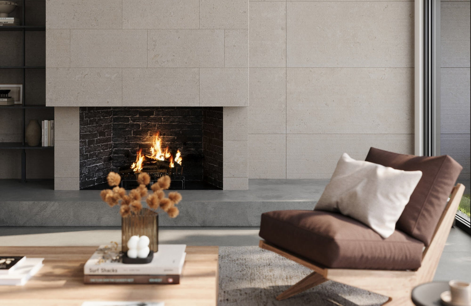 Soft decorative pillows support day to night comfort in this modern living room, layered against a warm brown accent chair beside a sleek stone fireplace.