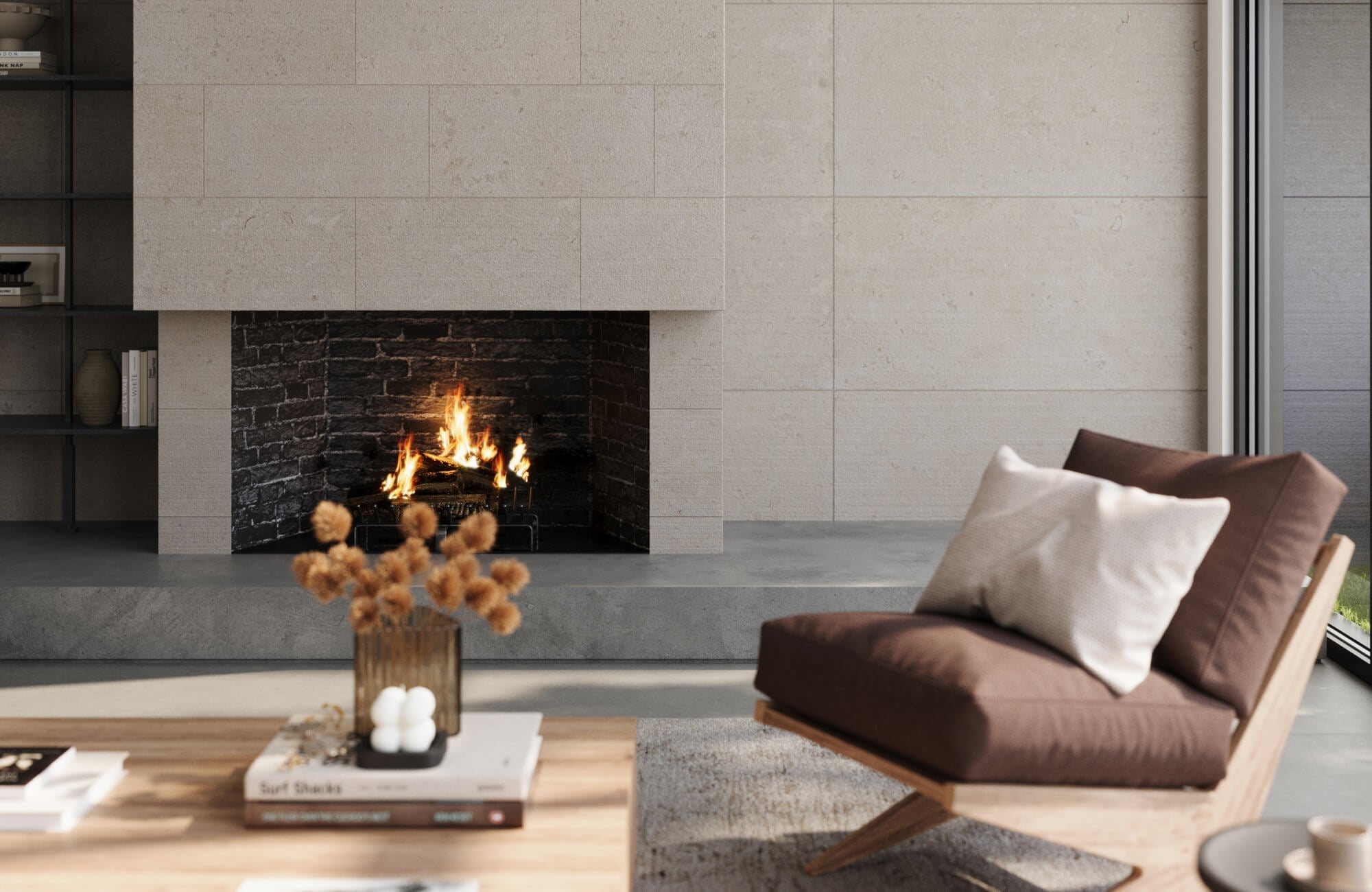 Soft decorative pillows support day to night comfort in this modern living room, layered against a warm brown accent chair beside a sleek stone fireplace.