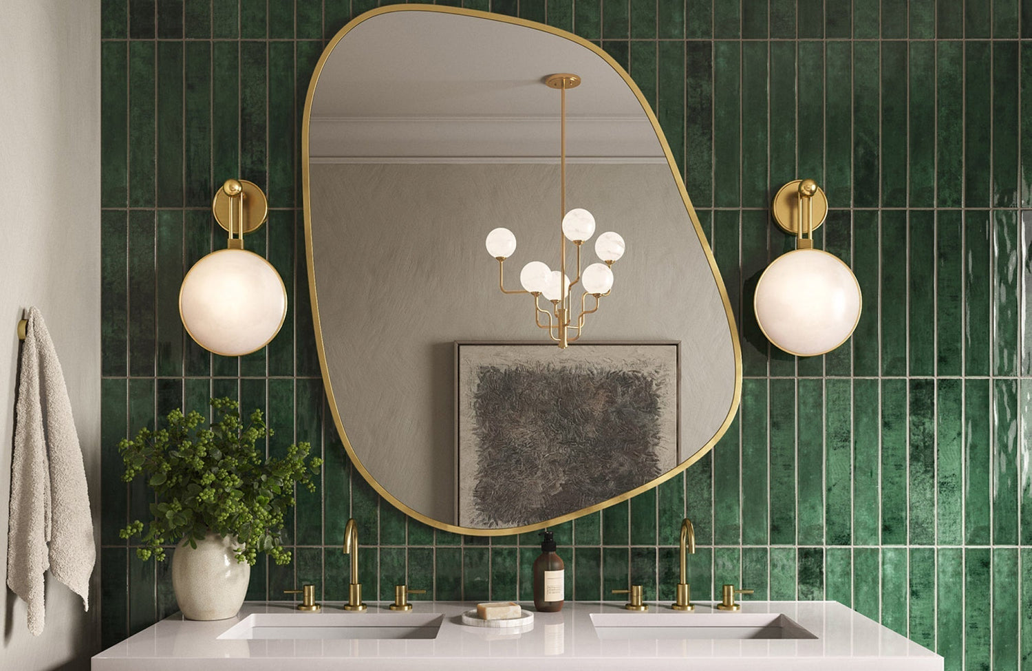 Double vanity with two sconces beside an asymmetrical mirror showing balanced lighting across both sinks.