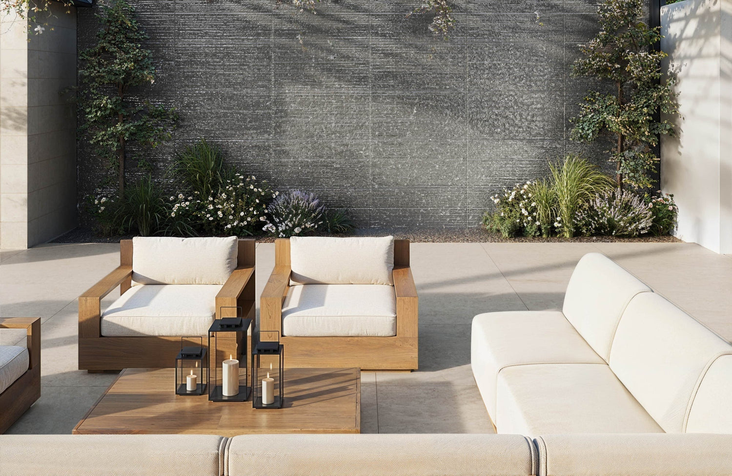 Outdoor porcelain tiles grace a contemporary patio, featuring a light-toned surface, cozy lounge seating, and a textured backdrop.