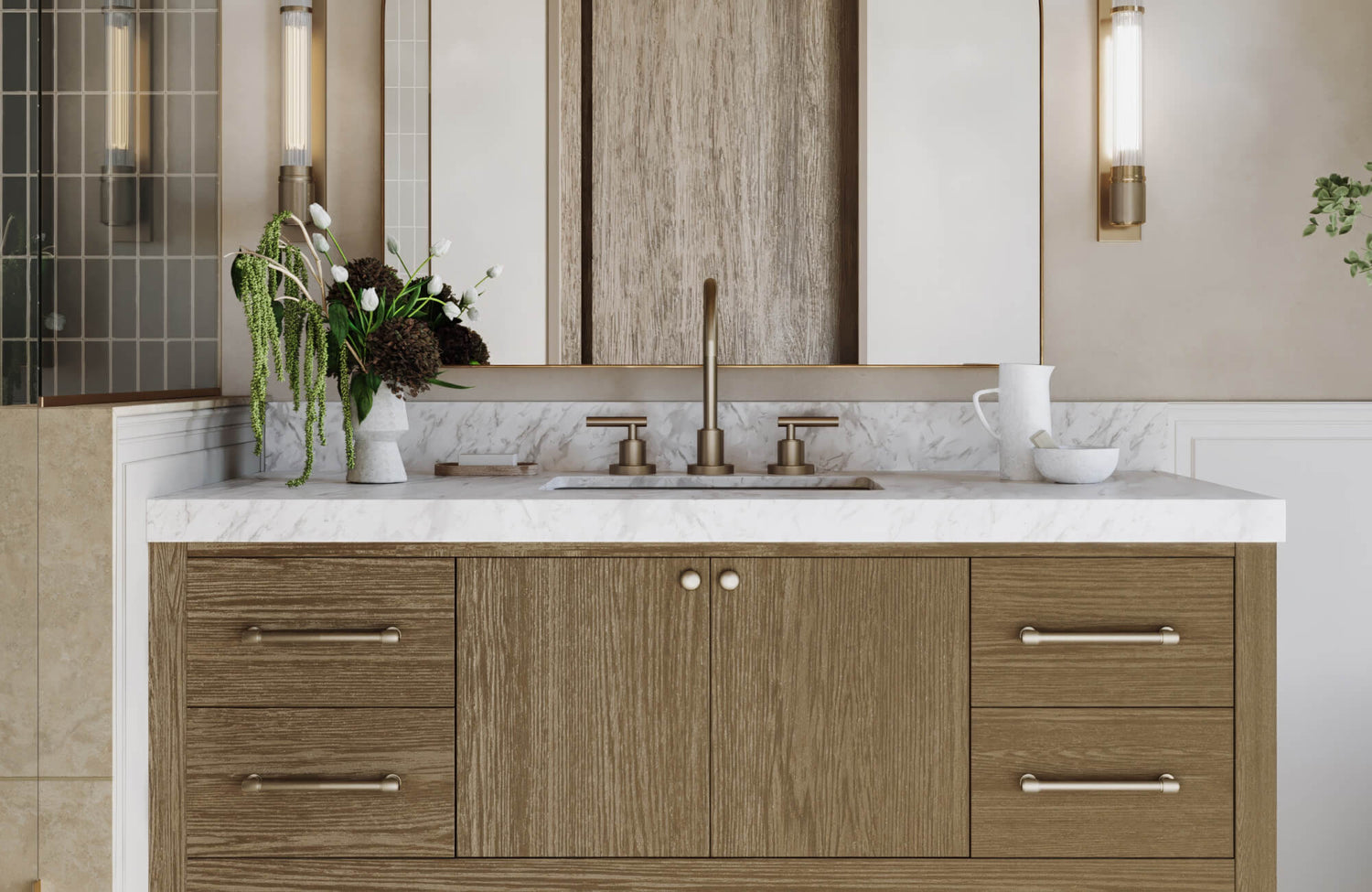 Wood grain double vanity with marble top and elegant brass faucet, flanked by vertical sconces and accented with floral decor, ideal for refined bathroom design.