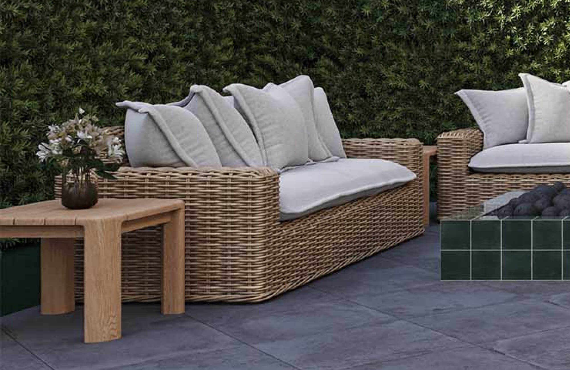 Outdoor wood end table beside woven lounge seating and a fire feature in a contemporary patio setting.