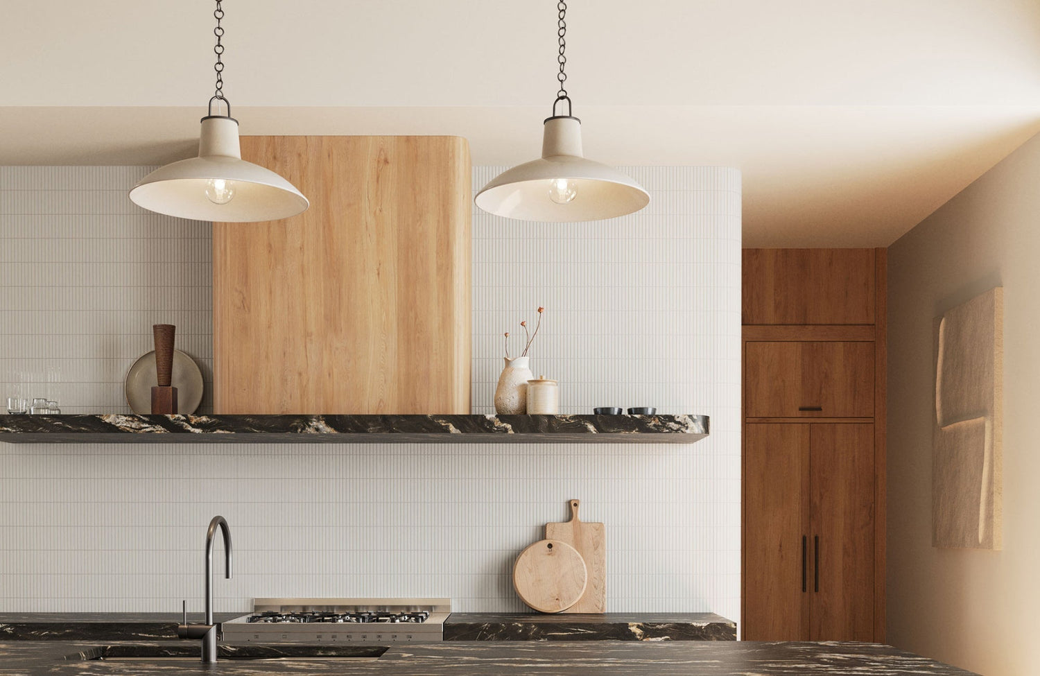 Two cream pendant lights with wide shades illuminate a modern kitchen with wood and stone accents.