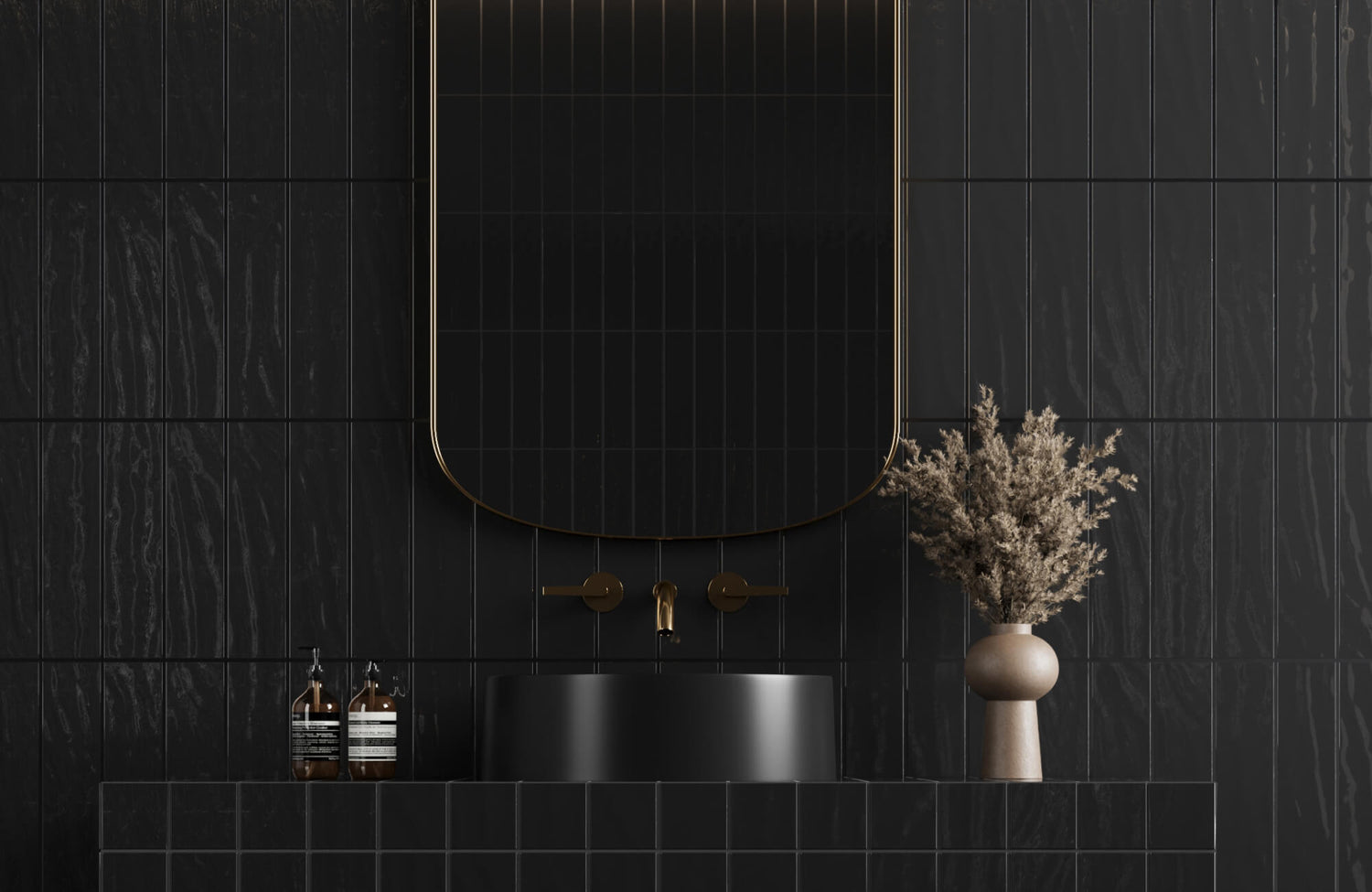 Modern black bathroom with textured subway tiles, a curved mirror with gold trim, a matte black sink, and brass fixtures.