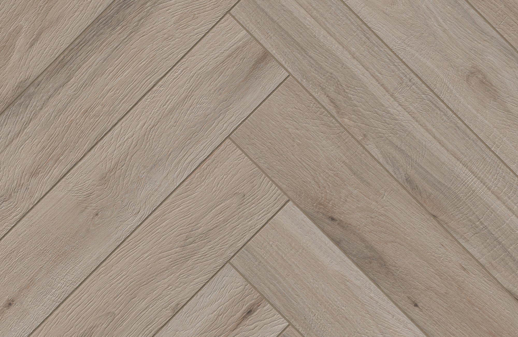 Preston 8x48 Matte Porcelain Tile in Birch showcases a natural wood-grain texture with warm, light hues arranged in a herringbone pattern.