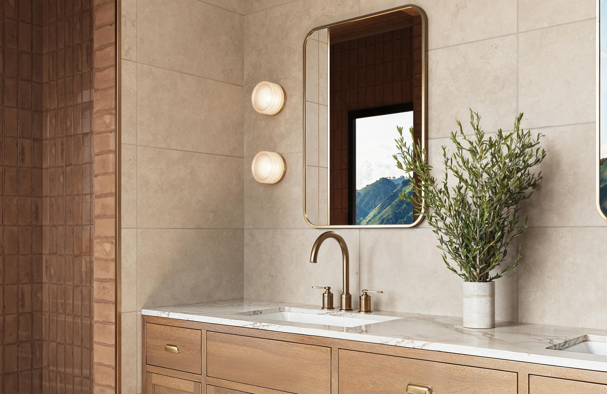 Polished bathroom with light beige marble look wall tiles, a marble vanity top, and brass fixtures, exuding warmth and elegance.