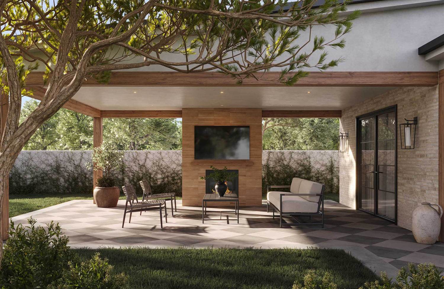 Covered outdoor patio with checkerboard tile flooring, cushioned sofa, lounge chairs, coffee table, and fireplace with TV.