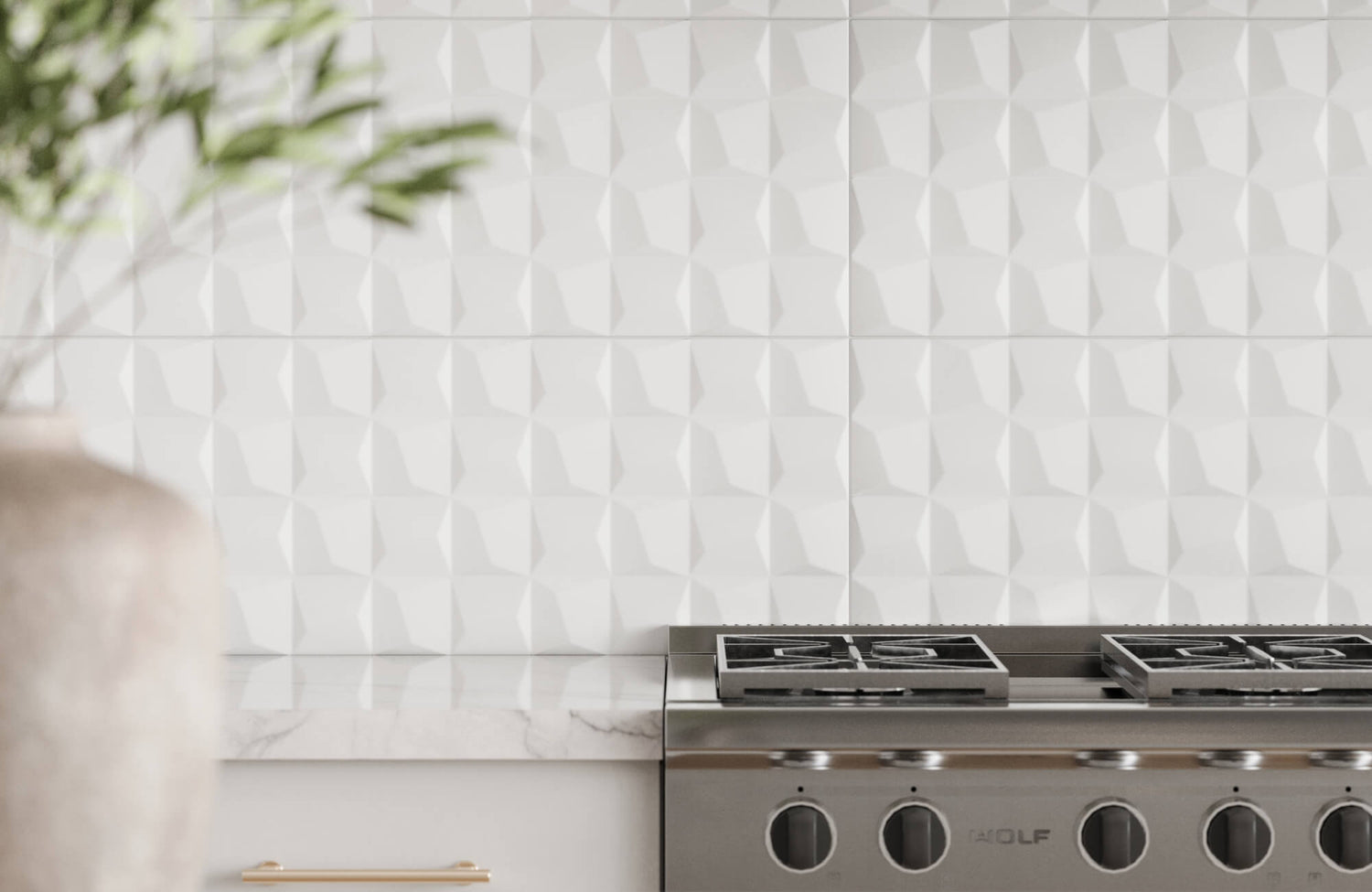 Textured white ceramic tiles in a faceted design featured as a kitchen backsplash, paired with a marble surface and contemporary stainless steel range.