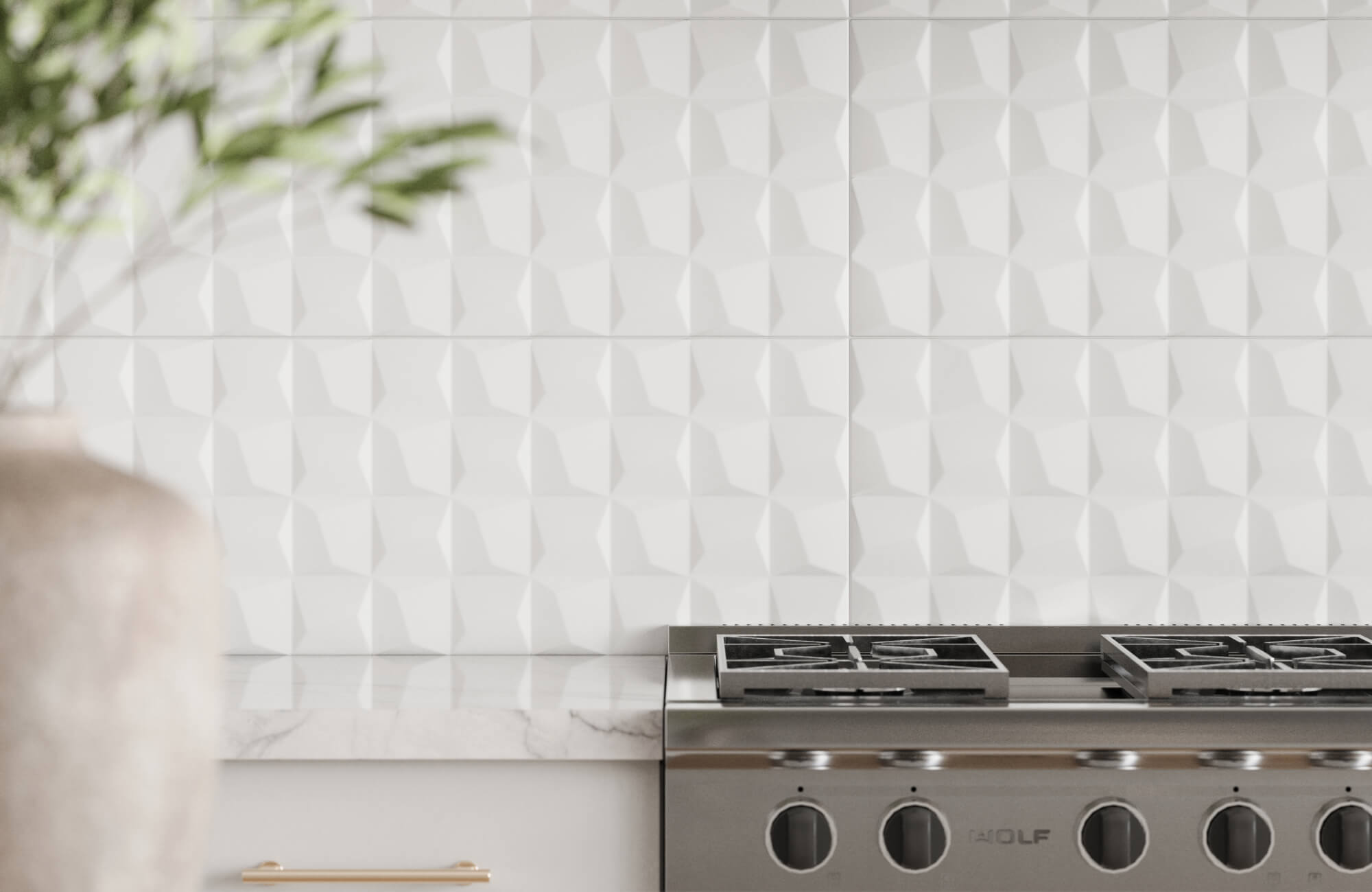 Textured white ceramic tiles in a faceted design featured as a kitchen backsplash, paired with a marble surface and contemporary stainless steel range.