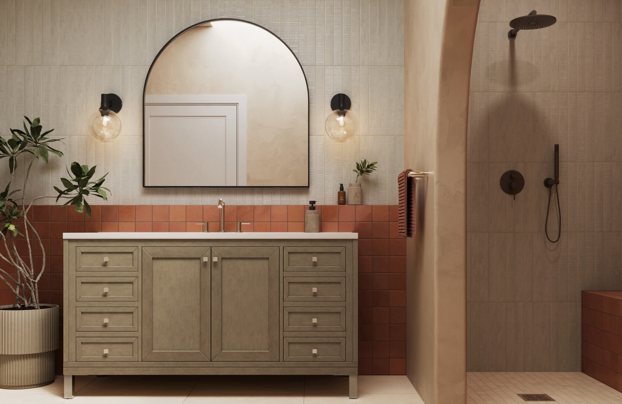 Modern bathroom design featuring an oversized arched mirror above a wood vanity, ribbed cream tile walls, and earthy terracotta backsplash detail.