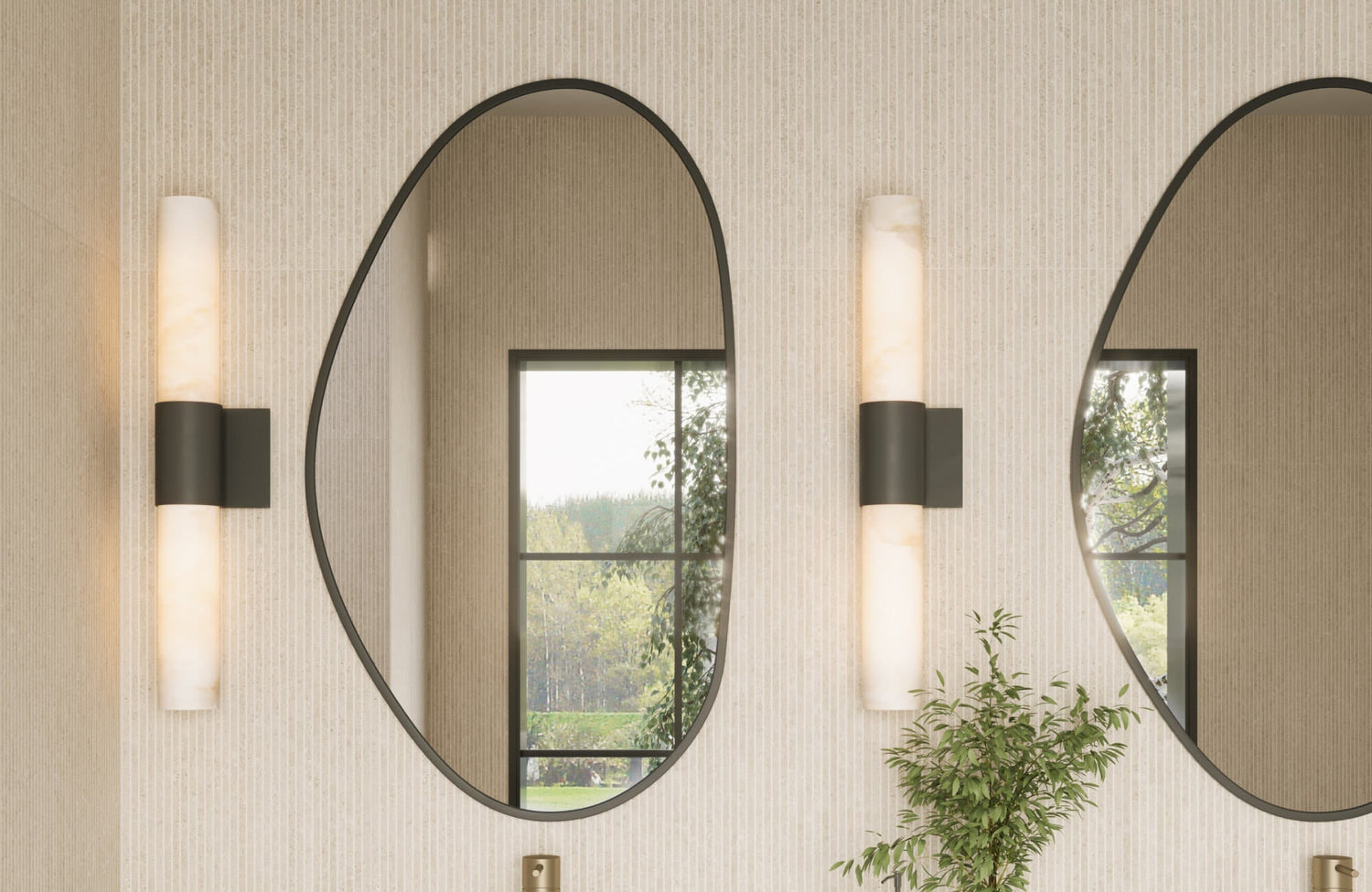 Bathroom vanity with vertically mounted alabaster sconces flanking large oval mirrors, set against light ribbed tile walls and black trim