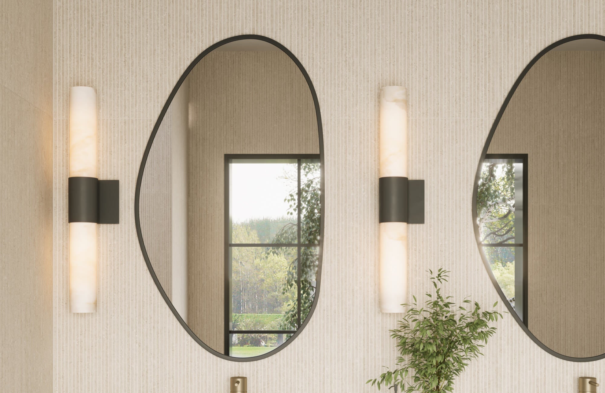 Bathroom vanity with vertically mounted alabaster sconces flanking large oval mirrors, set against light ribbed tile walls and black trim