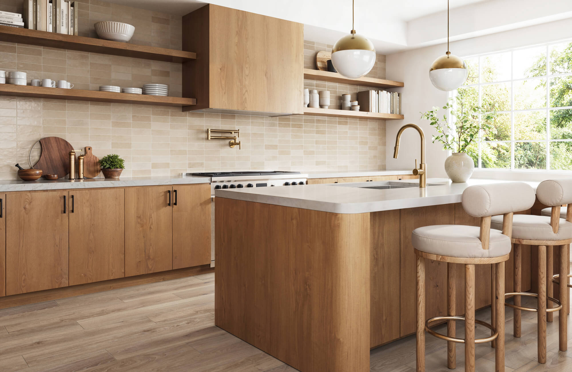 Warm-toned kitchen design featuring light wood finishes, open shelving, a curved-edge island, and soft neutral decor near a large sunlit window.