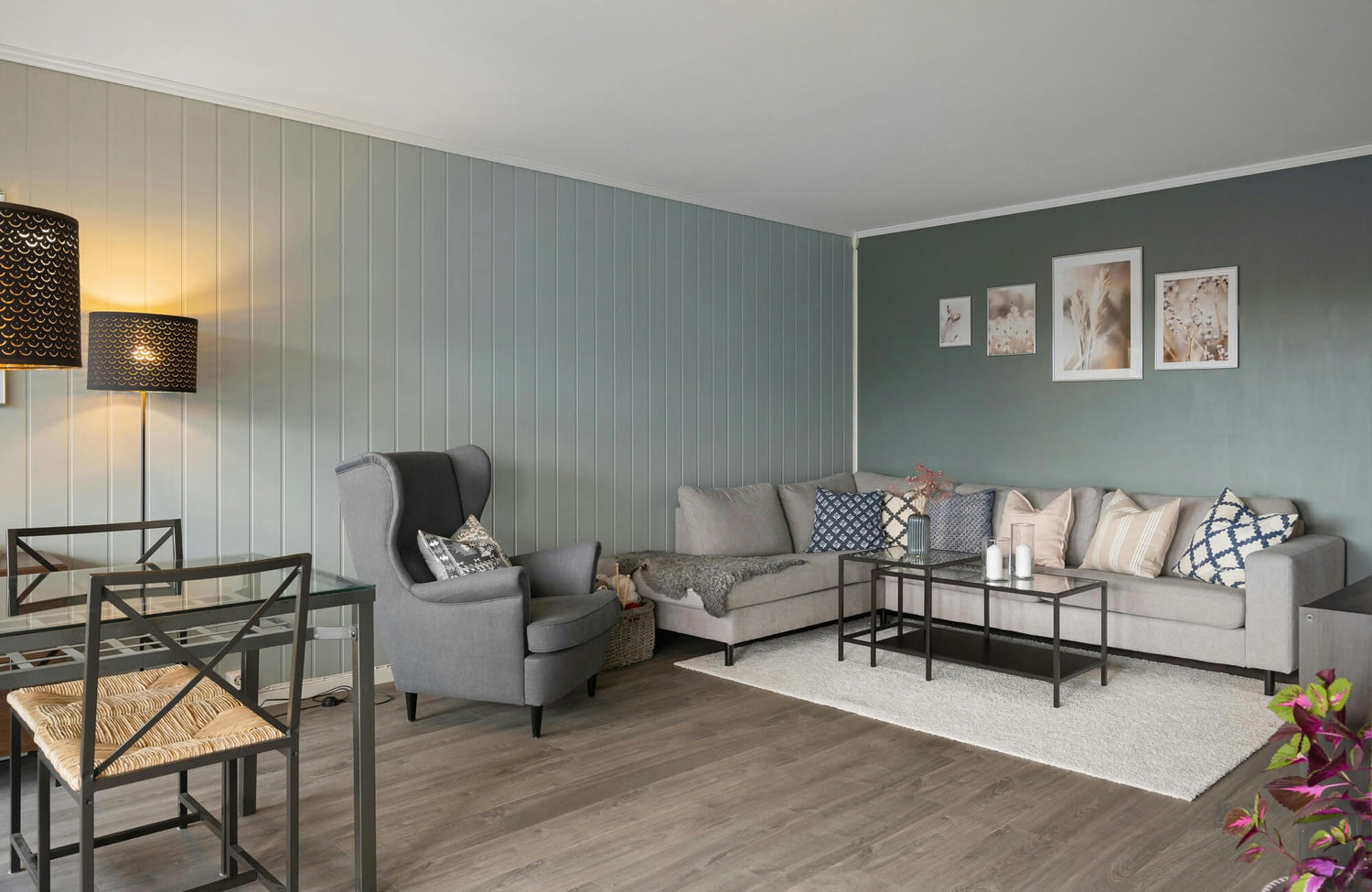 Modern living room with dual floor lamps creating ambient light, ideal for layering in overhead-free lighting plans.