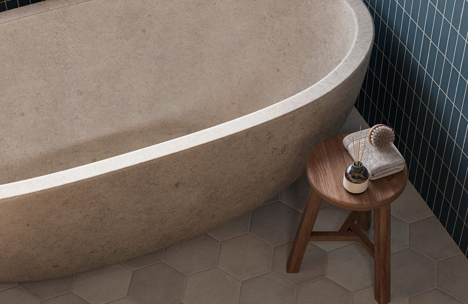 Serene bathroom featuring soft beige hexagon floor tiles, a textured stone bathtub, and warm natural light that highlights the clean lines and earthy tones.