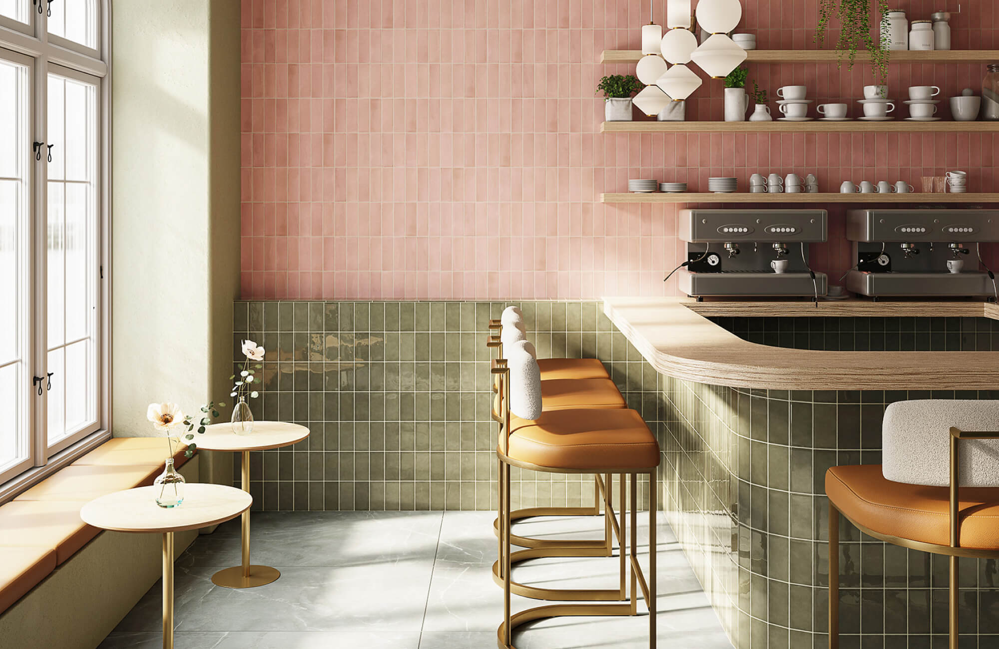 Soft pink vertical wall tiles paired with olive green square tiles, creating a two-tone café interior pattern.