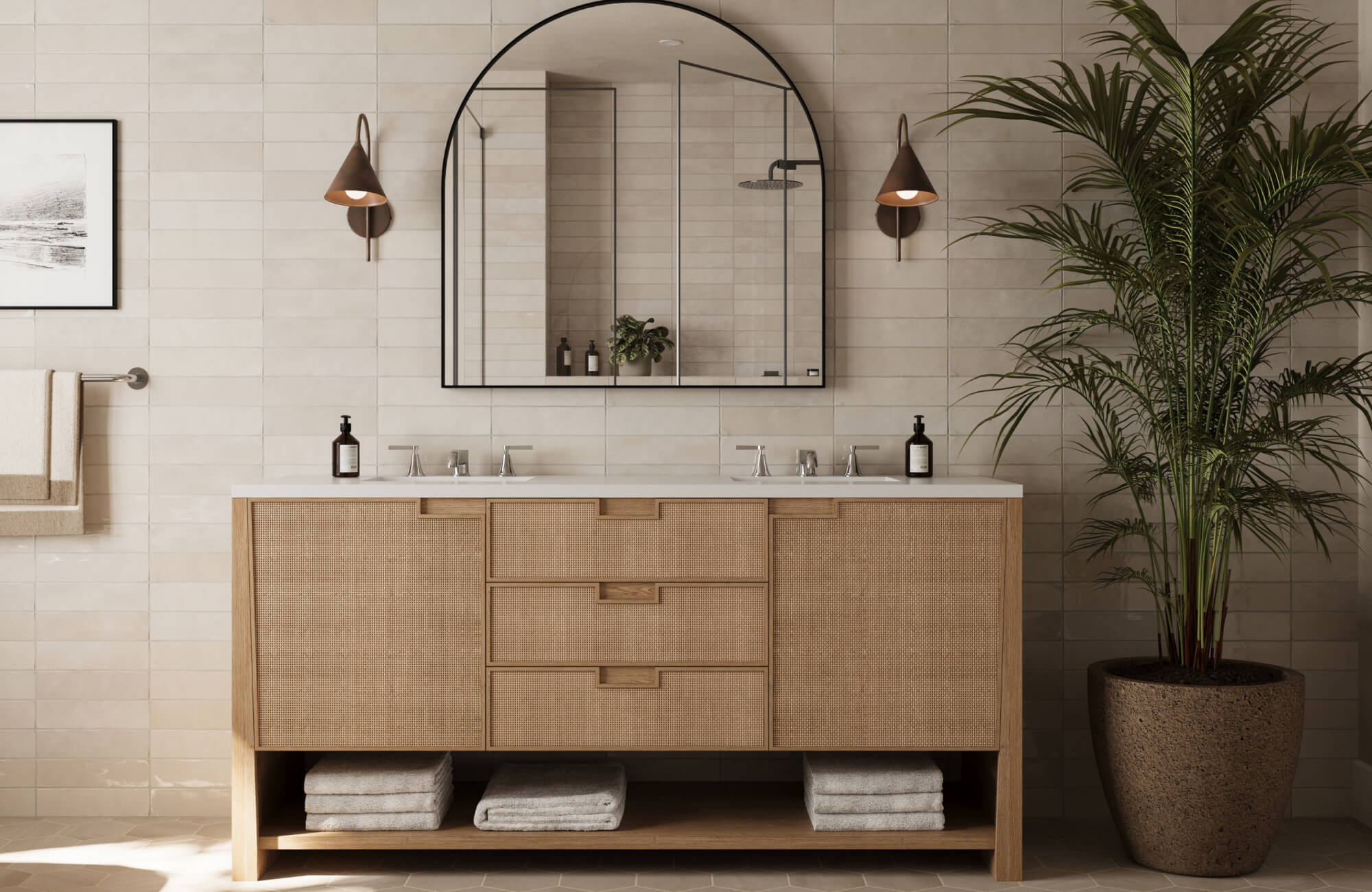 Warm neutral bathroom with beige matte subway tiles, natural wood vanity, black-framed arched mirror, and copper-toned sconces for a cozy modern aesthetic