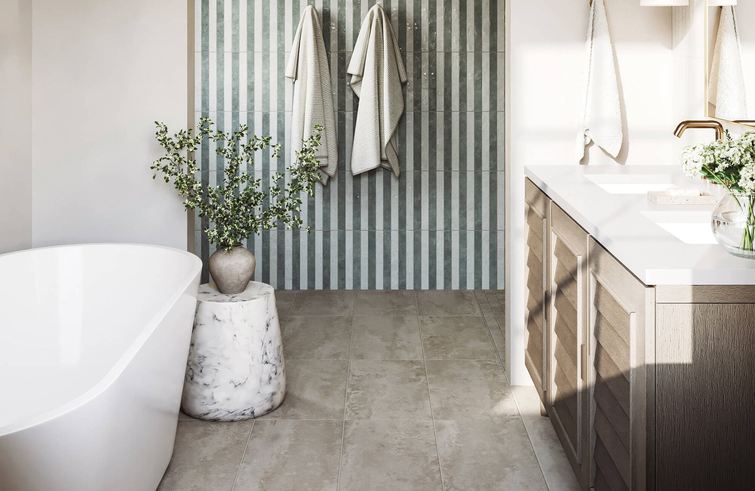 Double sink bathroom vanity with wood cabinetry and white countertop set beside a freestanding tub, paired with striped tile walls and soft natural light for a balanced layout.