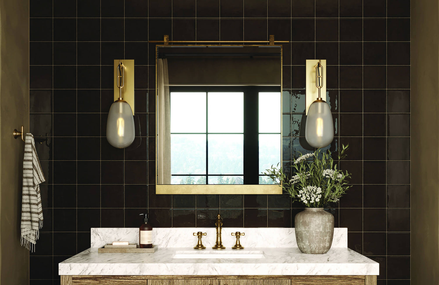 Bathroom vanity with marble countertop, brass fixtures, and twin frosted glass sconces framing a large mirror.