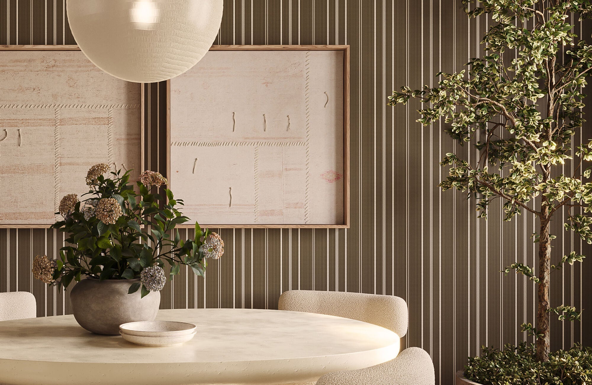 Neutral-toned minimalist wall art featuring two large textured abstract panels, mounted on a brown striped wallpapered wall above a round cream dining table with a ceramic vase, complemented by a paper pendant light.