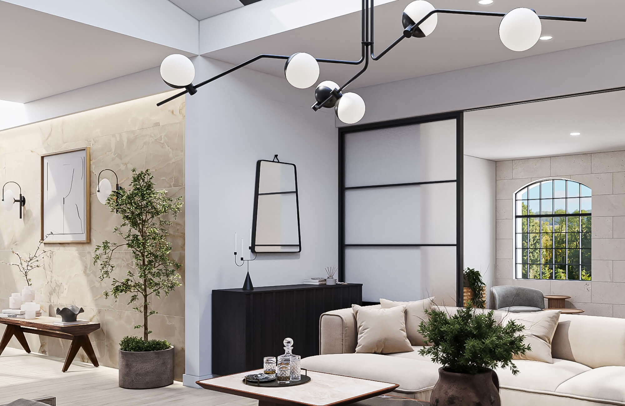 Contemporary chandelier with black metal arms and frosted globe bulbs suspended above a neutral-toned living room.