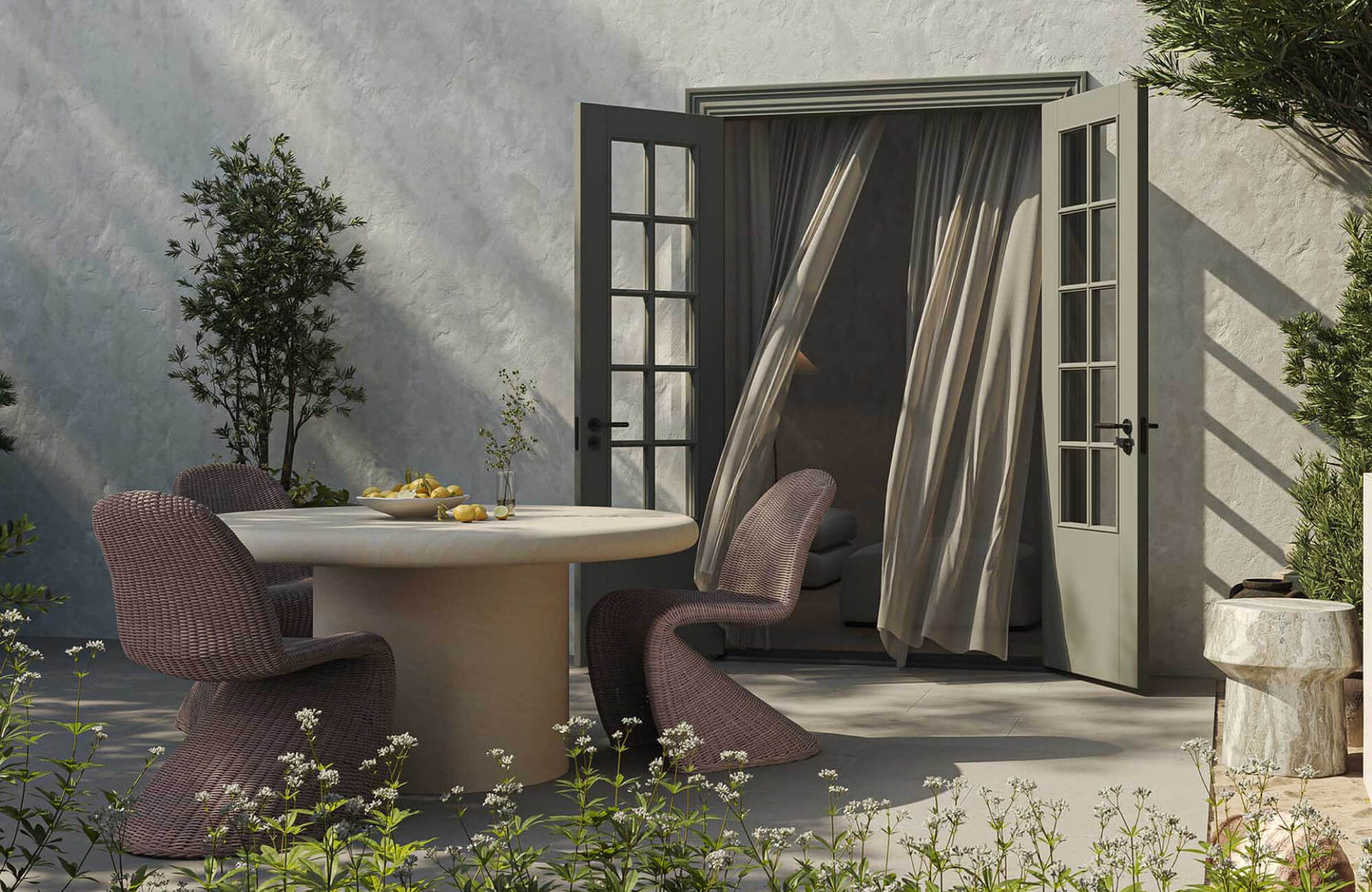 Outdoor patio with sculptural woven chairs, a round dining table, an end table, open French doors, and soft neutral finishes.