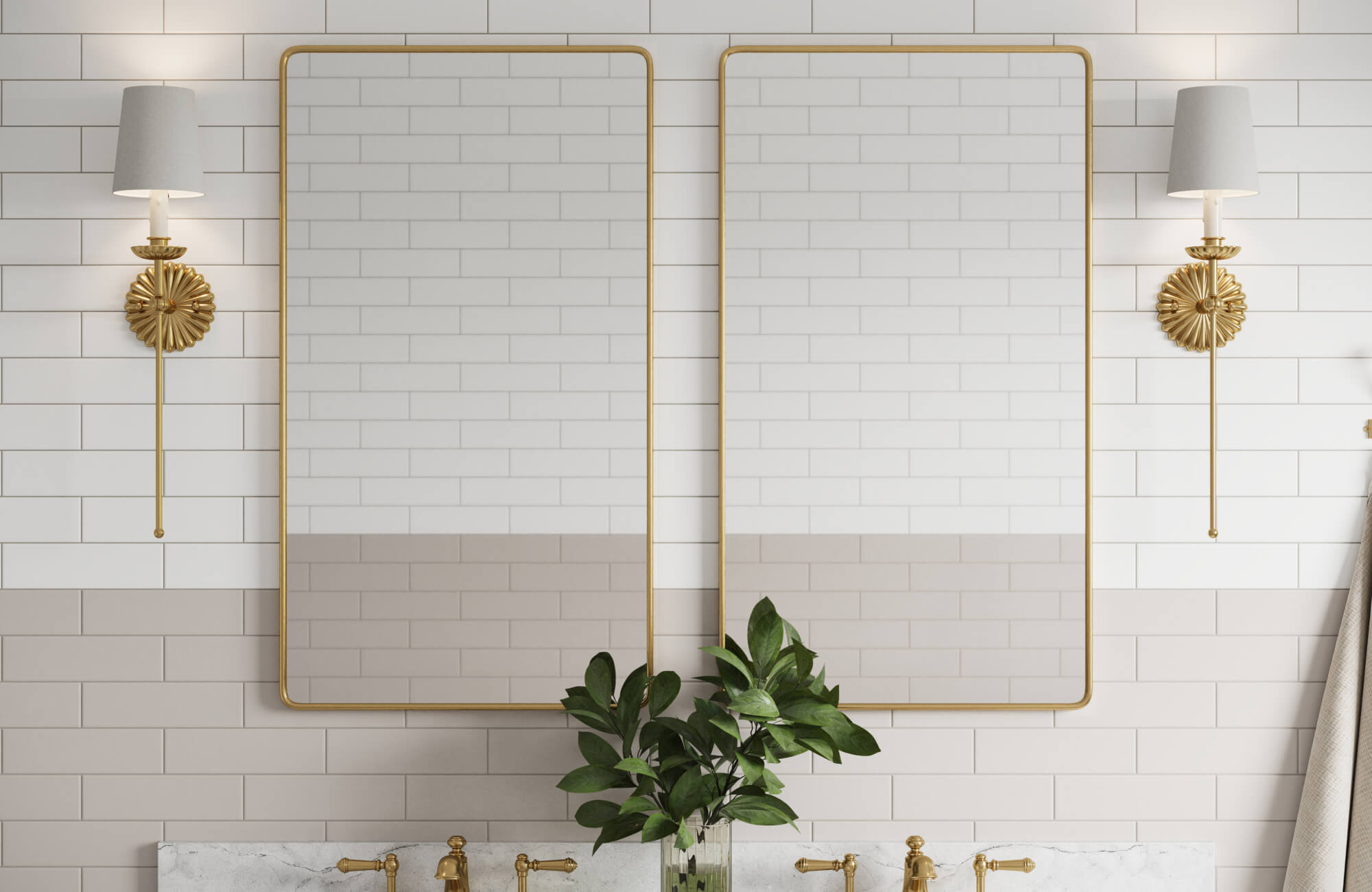 Elegant bathroom vanity wall with two gold-framed mirrors, white subway tiles, brass fixtures, and decorative sconces for a timeless appeal.
